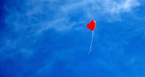 Untethered love-a released, heart-shaped balloon