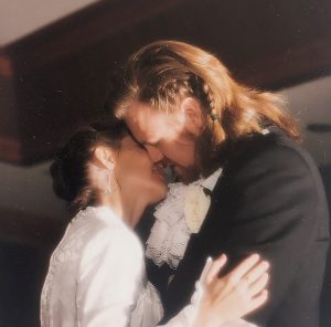 Close up of me and my husband dancing at our wedding, a quarter century ago